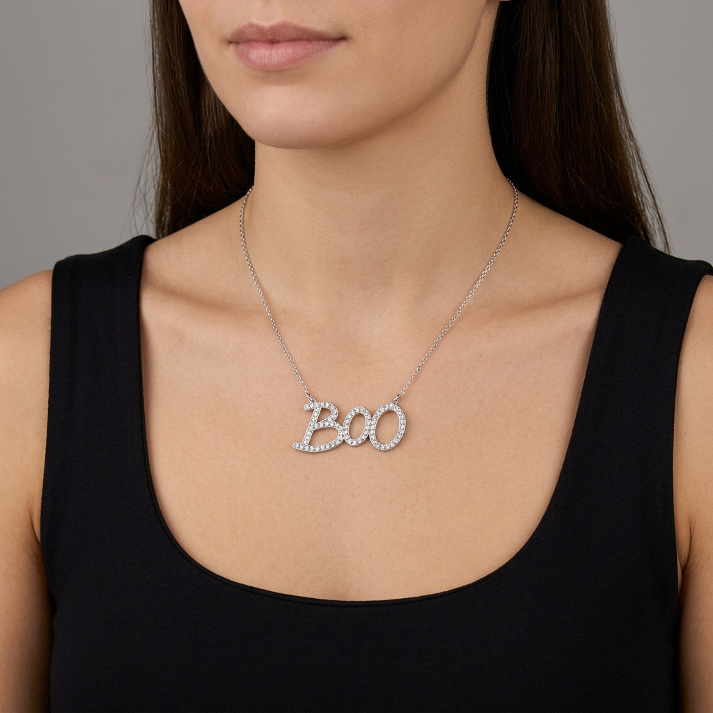 Woman wearing the silver-tone BOO necklace with a plain black party top