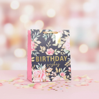 Small pink multi-coloured floral birthday gift bag 6x4.5 inch product shot on pastel background