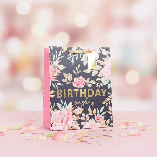 Small pink multi-coloured floral birthday gift bag 6x4.5 inch product shot on pastel background