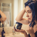 Person applying La Riche Directions Midnight Blue hair dye at home, candid lifestyle moment