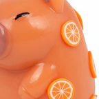 Extreme macro close-up of the Scrunchems Squishy Capybara showing soft rubbery texture and orange citrus slice detail