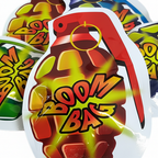 Extreme macro close-up of HTI Boom Bomb Bag holographic foil texture and bold BOOM BAG print detail