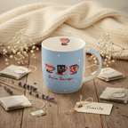 Flat lay of the You're Tea-Riffic gift mug with tea bags, dried flowers and a gift tag on a rustic wooden surface
