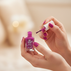 Barry M Hi-Vis Neon Nail Paint Fearless Purple 243 – woman applying neon purple nail polish, candid close-up with creamy bokeh background