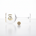 Art Deco 60th Birthday Gin Glass placed beside a £1 coin on white background to show size
