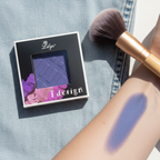 Lilyz Eyeshadow Mono Denim Blue on denim surface with makeup brush and colour swatch