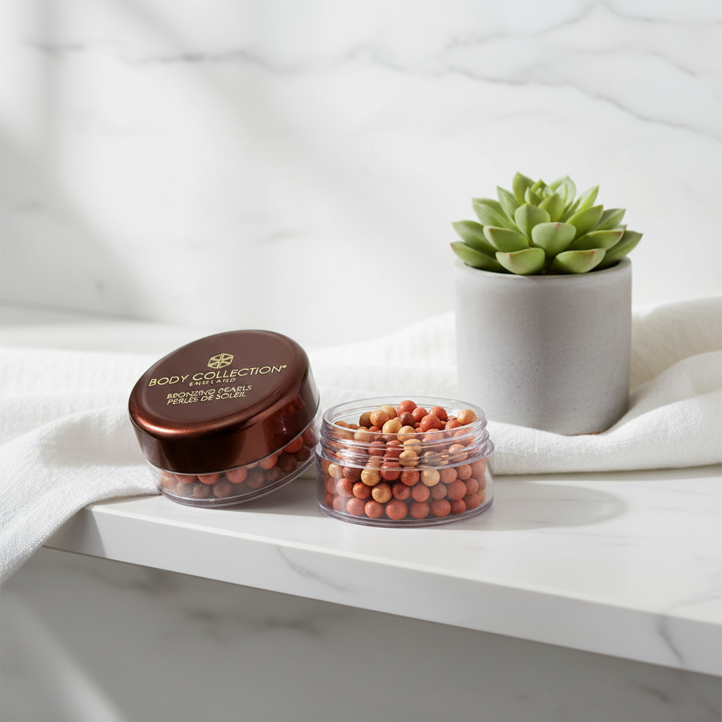 Body Collection Bronzing Pearls jar on marble bathroom shelf with succulent and white linen — natural window light lifestyle shot