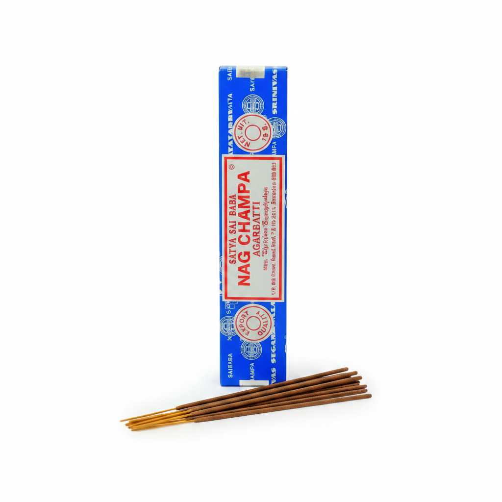 Satya Sai Baba Nag Champa Agarbatti incense sticks 15g pack on white studio background — cobalt blue box with cream label and red accents, tan and brown incense sticks fanned out in front