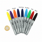 Tallon Permanent Markers 8 Pack flat lay with all 8 markers fanned out beside a £1 coin to show scale, white background overhead lighting