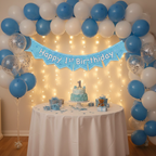 Complete first birthday party setup with blue glitz banner as centrepiece