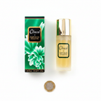 Chacal 55ml golden bottle and emerald green box flat lay with £1 coin for scale — clean white background