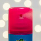 Extreme macro close-up of Party Success fluorescent pink hair colour spray nozzle showing fine mist and glossy pink cap detail