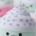 Extreme macro close-up of squishy cupcake toy foam texture and lavender heart detail