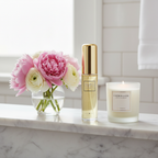 Tutu Woman perfume bottle on marble bathroom shelf with flowers and candle
