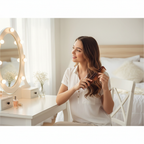 Young woman styling hair with tortoiseshell comb at vanity mirror - Hair Comb Set lifestyle