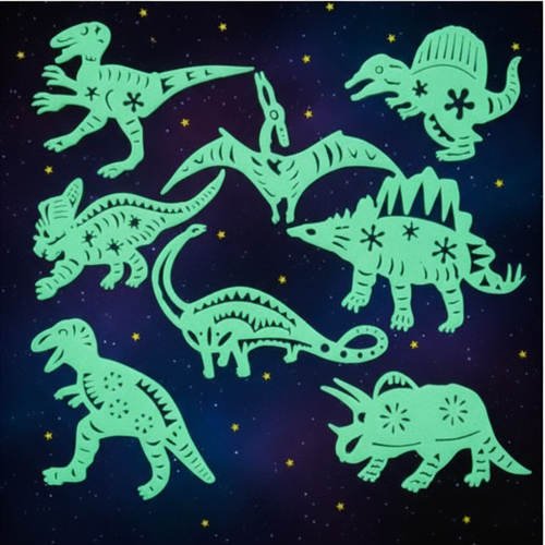 Glow in the dark stick on dinosaur figures arranged on a deep midnight blue starry background, glowing luminous green
