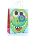 Medium kids gift bag with multi-coloured dinosaur print and ribbon carry handle
