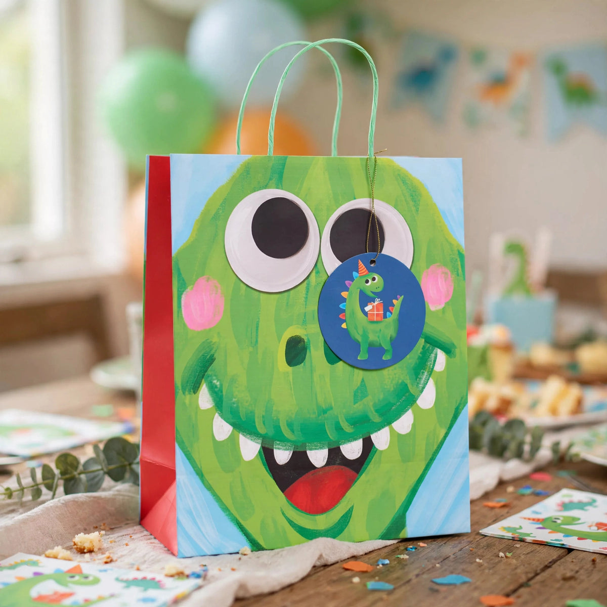 Kids gift bag with dinosaur print used for children's birthday or dinosaur-themed party gifts