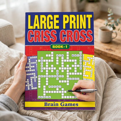 Person using Large Print Criss Cross Book A5 for puzzle entertainment at home or while travelling