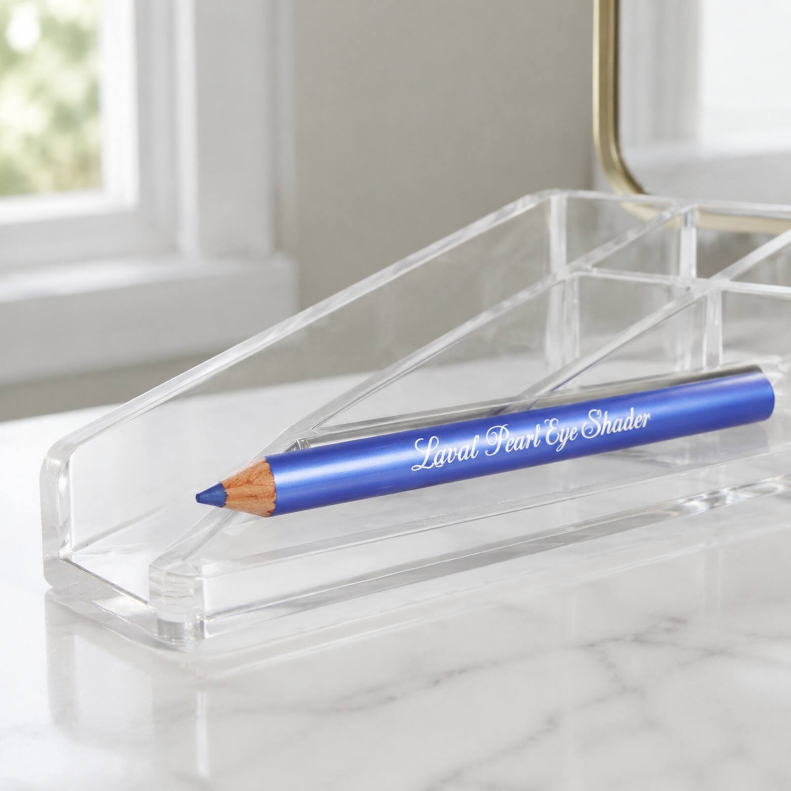 Laval Sapphire Blue eyeshadow pencil stored in a clear makeup organiser