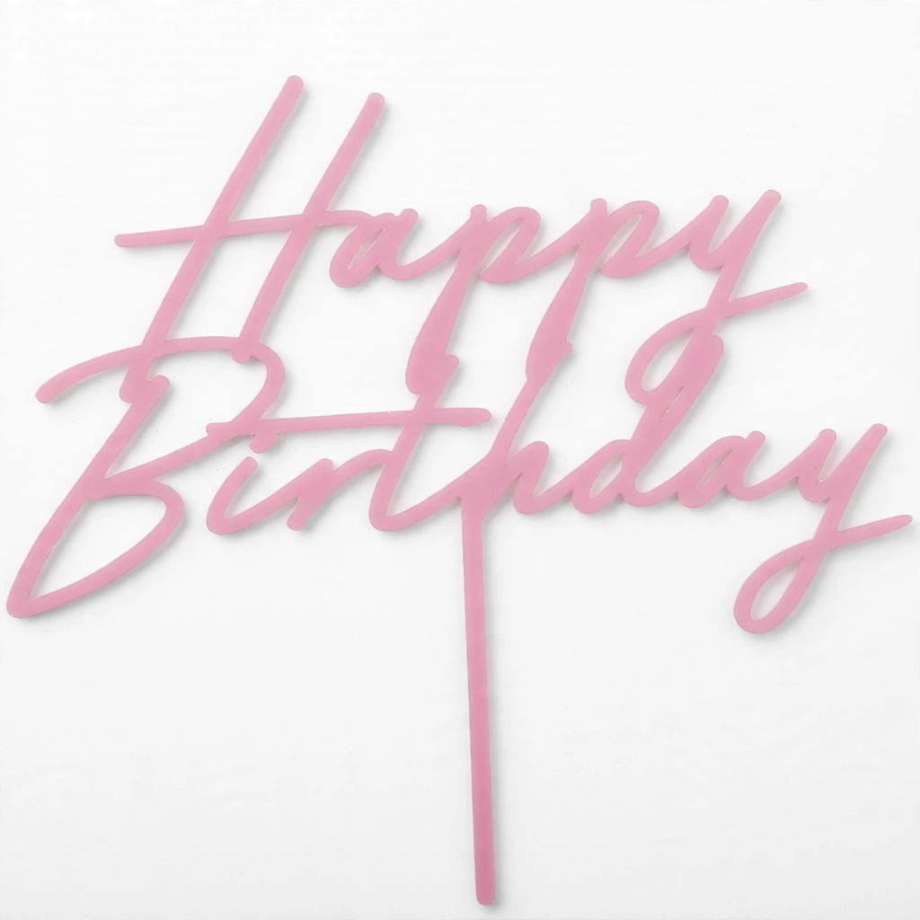 Close-up view of light pink Happy Birthday acrylic cake topper with two stakes