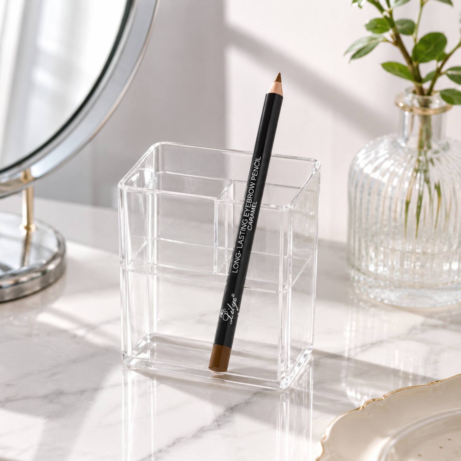 Lilyz Caramel Brown eyebrow pencil stored in a clear makeup organiser