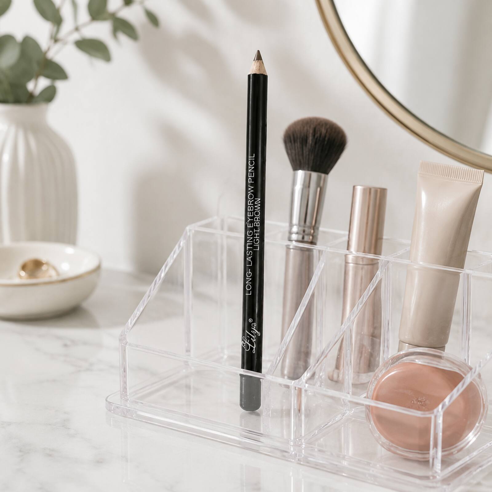 Lilyz Light Brown eyebrow pencil stored in a clear makeup organiser