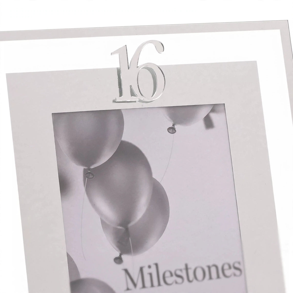 Close-up of silver Milestones photo frame marked Age 16 holding a 4x6 photo