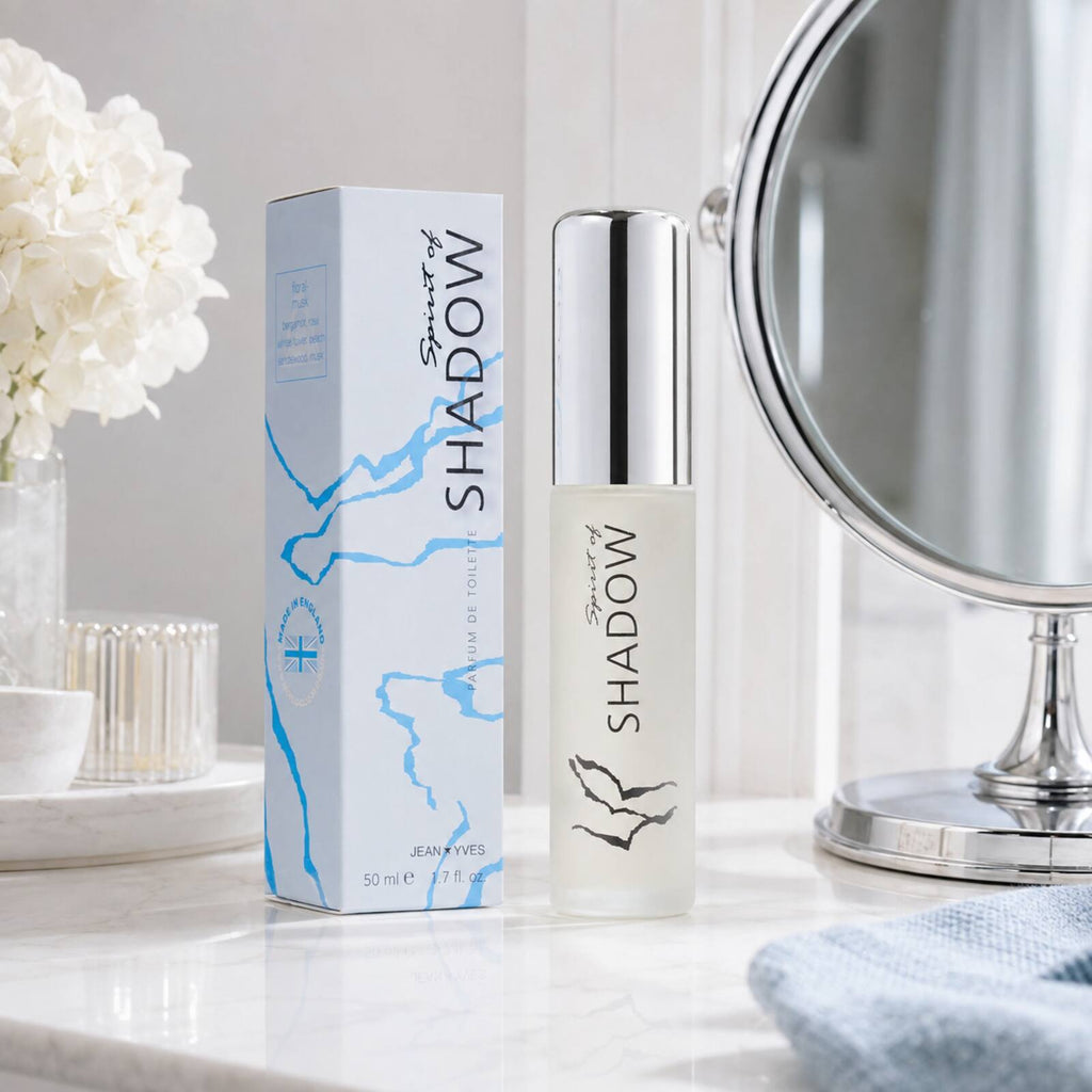 Spirit of Shadow 50ml bottle and pale-blue box displayed beside a vanity mirror