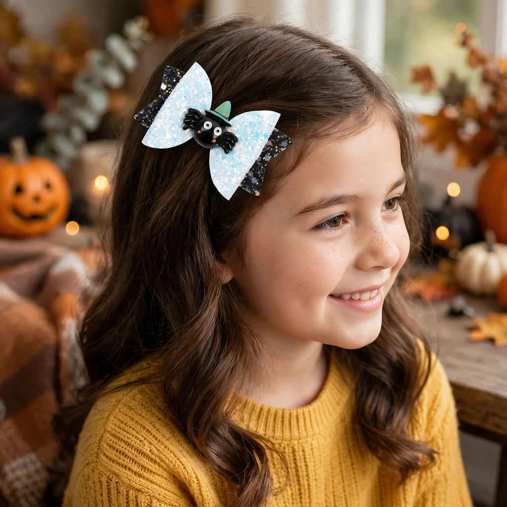 Mischief spider bowknot hair clips worn in a girl's hairstyle for Halloween