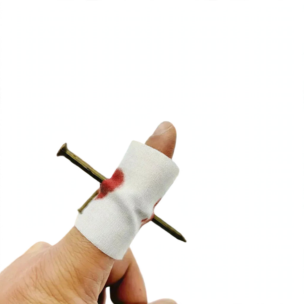 Nail Through Finger Joke prop with realistic nail-through-finger appearance