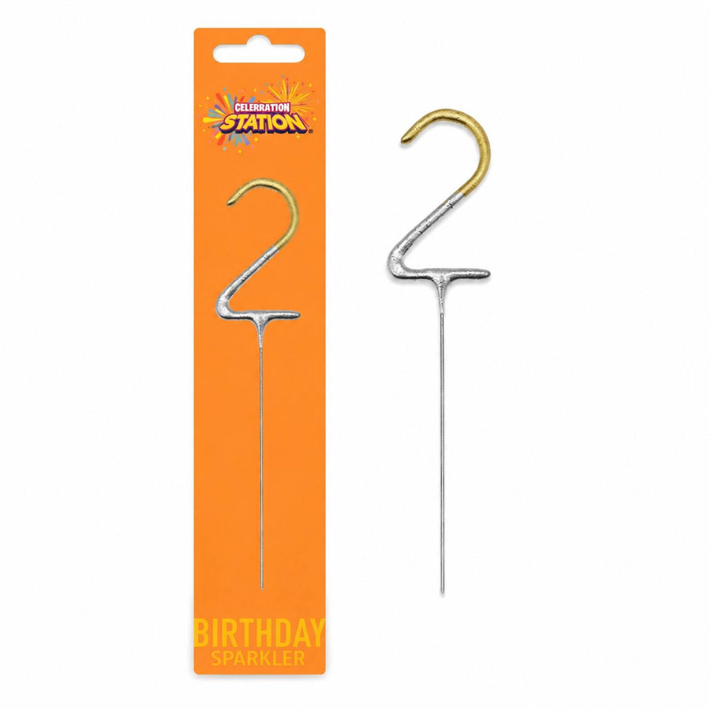 Gold number 2 birthday sparkler shown beside its orange Celebration Station packaging