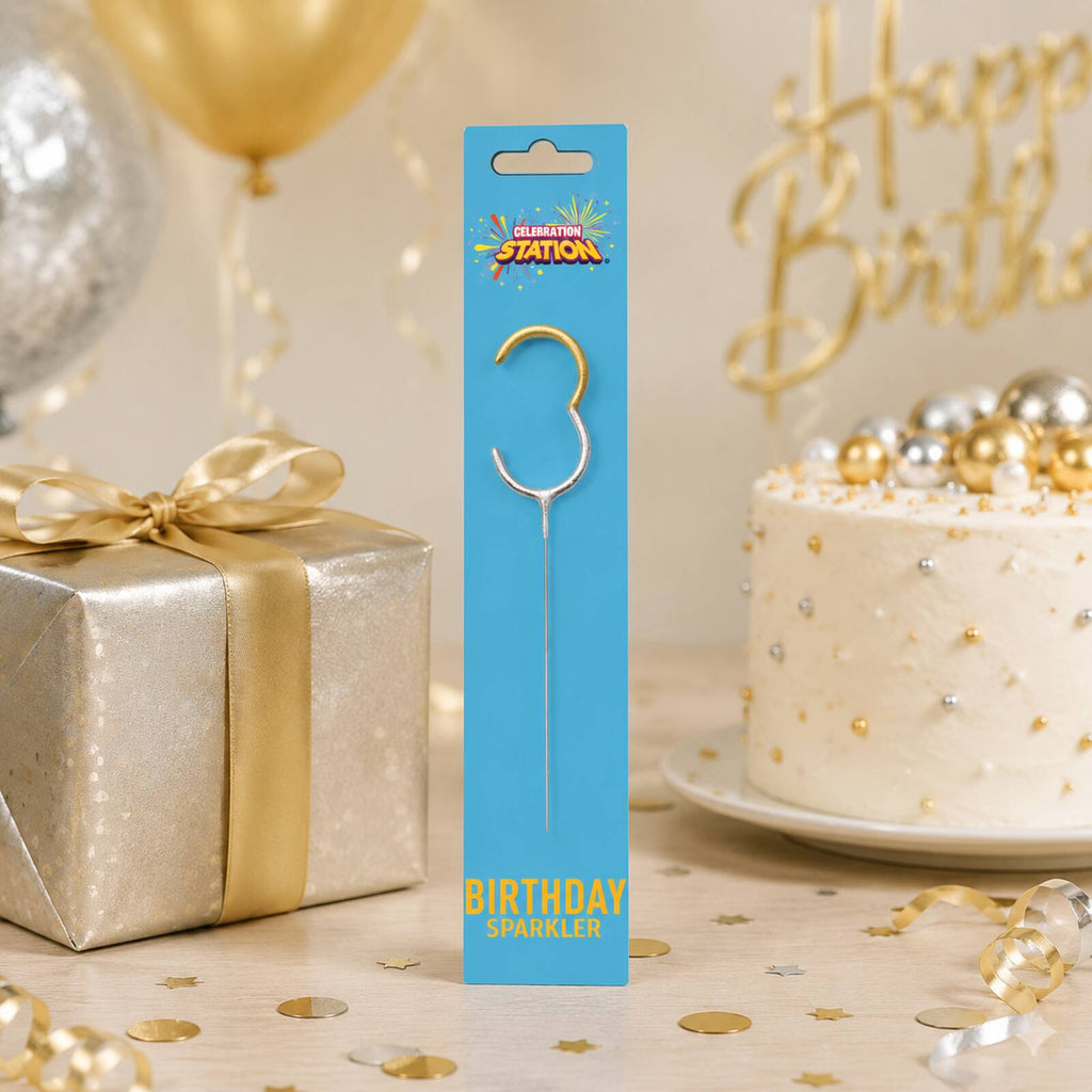 Celebration Station number 3 birthday sparkler displayed with a gift and cake