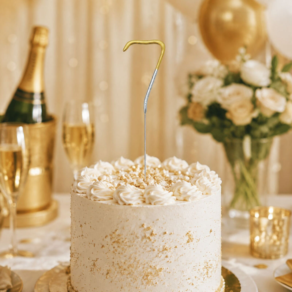 Unlit number 7 gold and silver birthday sparkler displayed in an elegant celebration cake