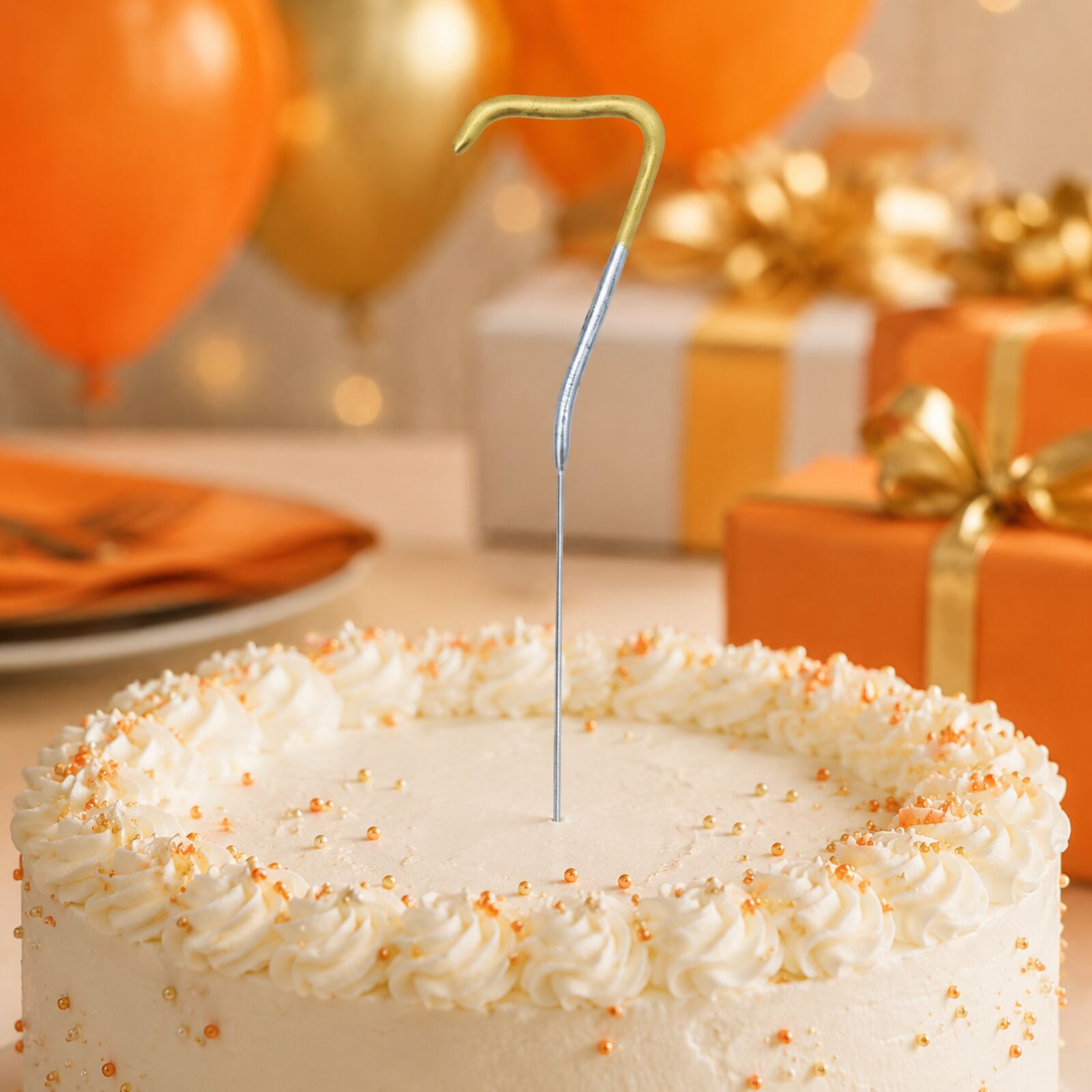 Unlit number 7 gold and silver sparkler displayed on an orange birthday party cake
