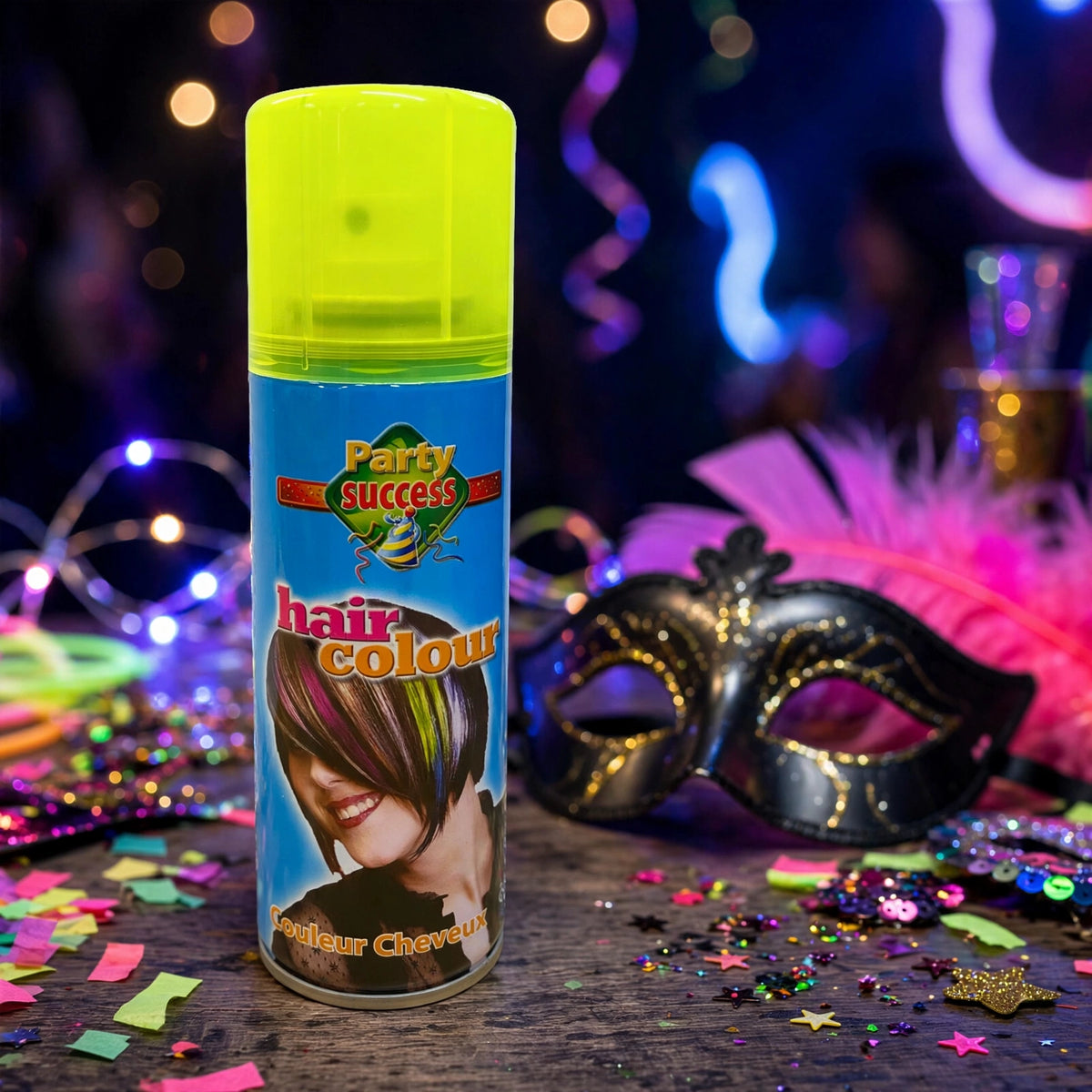 Fluorescent yellow hair colour spray being applied to dry hair before an event