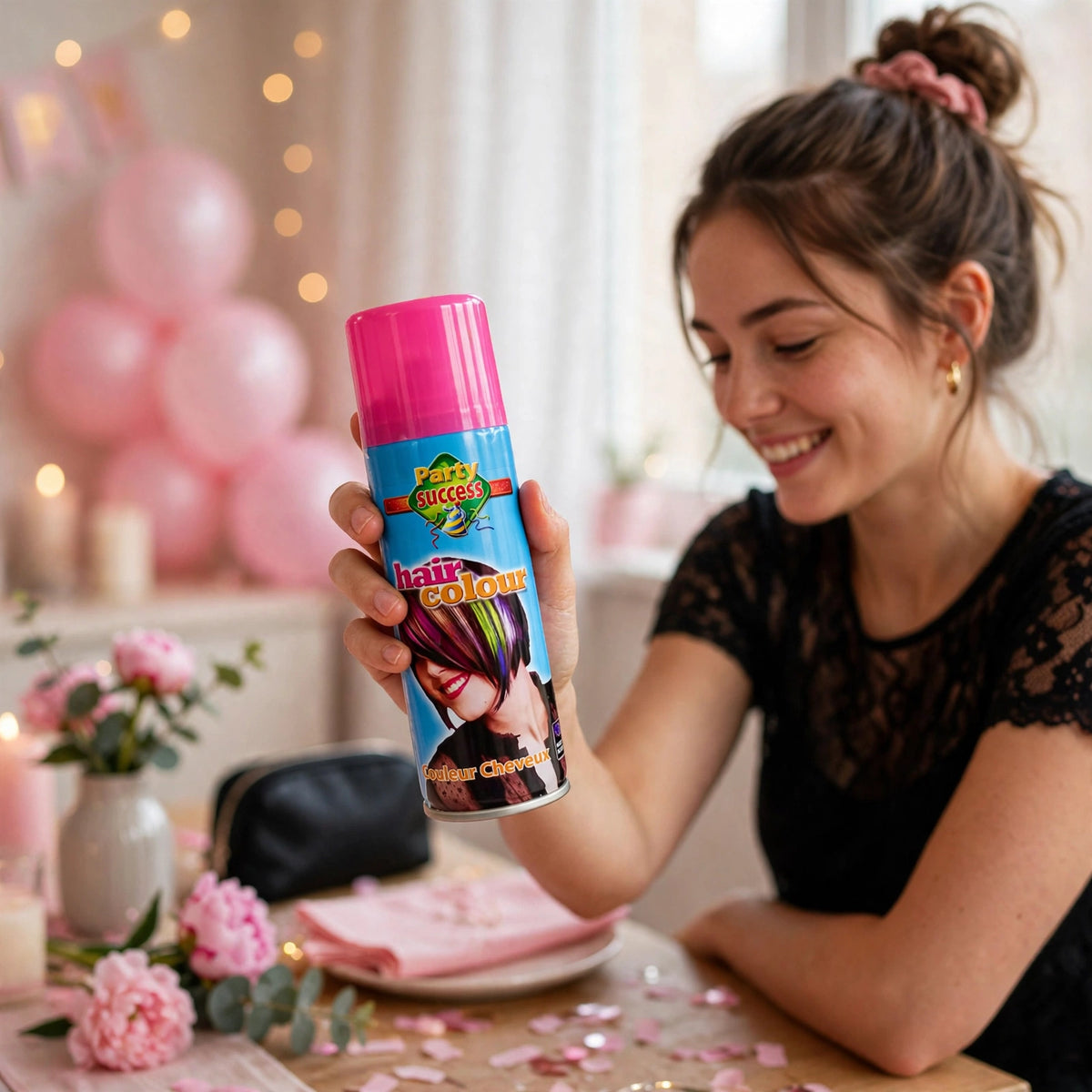 Party Success pink temporary hair colour spray being applied to hair before an event