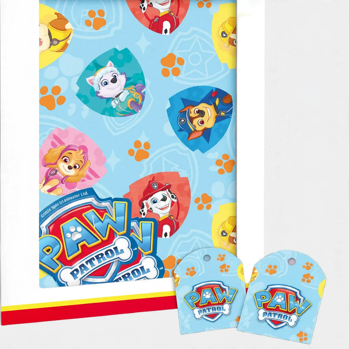 Close-up view of Paw Patrol wrapping paper and matching gift tags