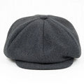 Peaky Blinders style flat cap in grey herringbone with eight-panel newsboy silhouette and structured peak