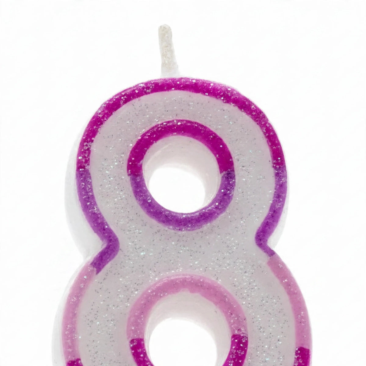 Close-up view of pink glitter number 8 birthday candle