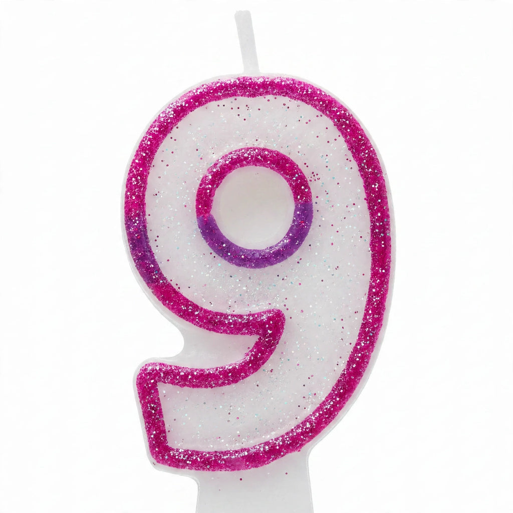 Close-up of pink glitter number 9 birthday candle