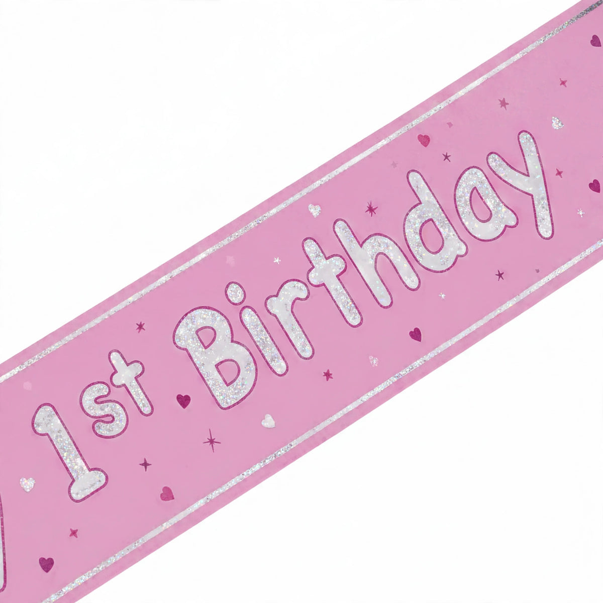 Close-up of Pink Glitz Happy 1st Birthday prismatic foil banner