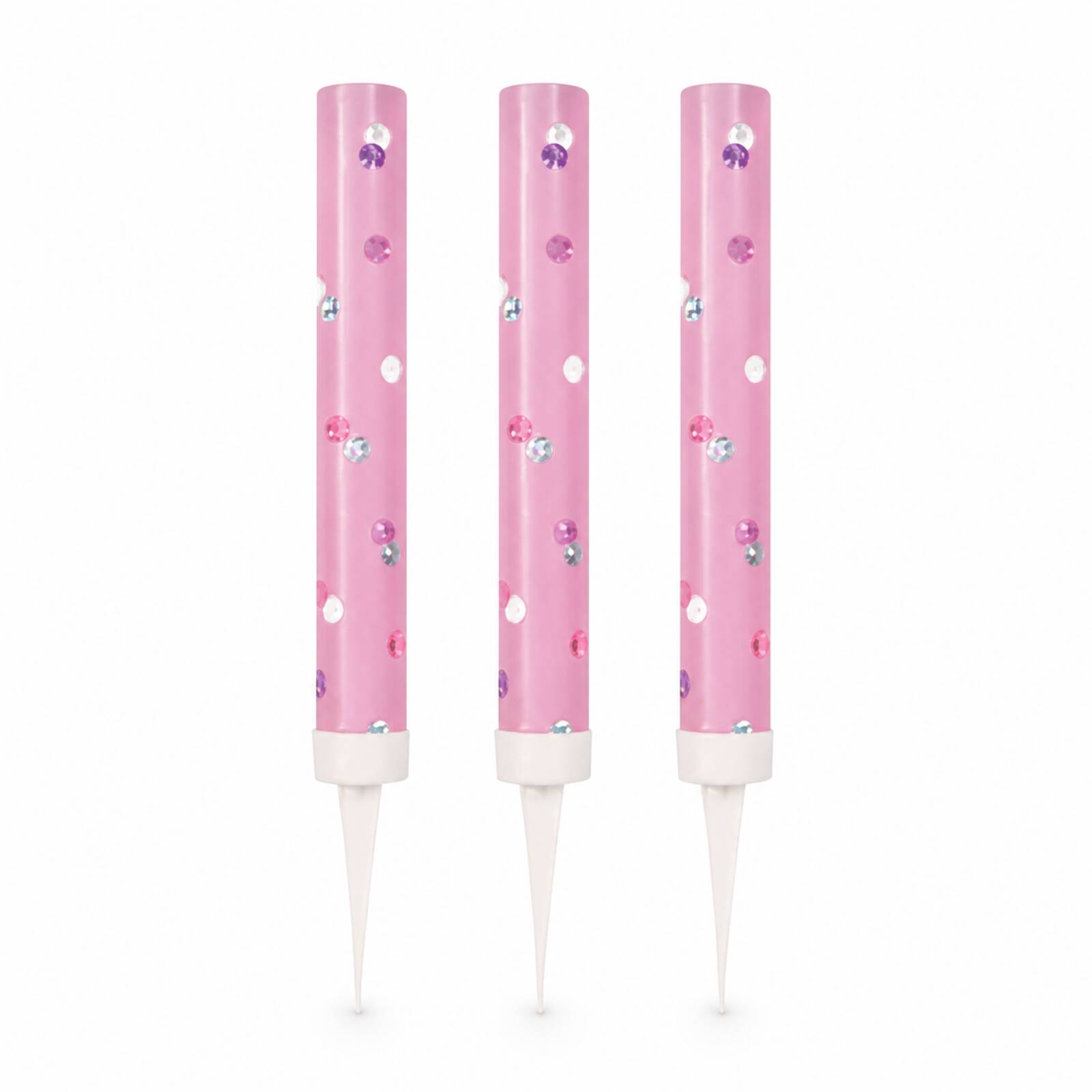 Three pink glitz ice fountain cake decorations with reflective dots on white