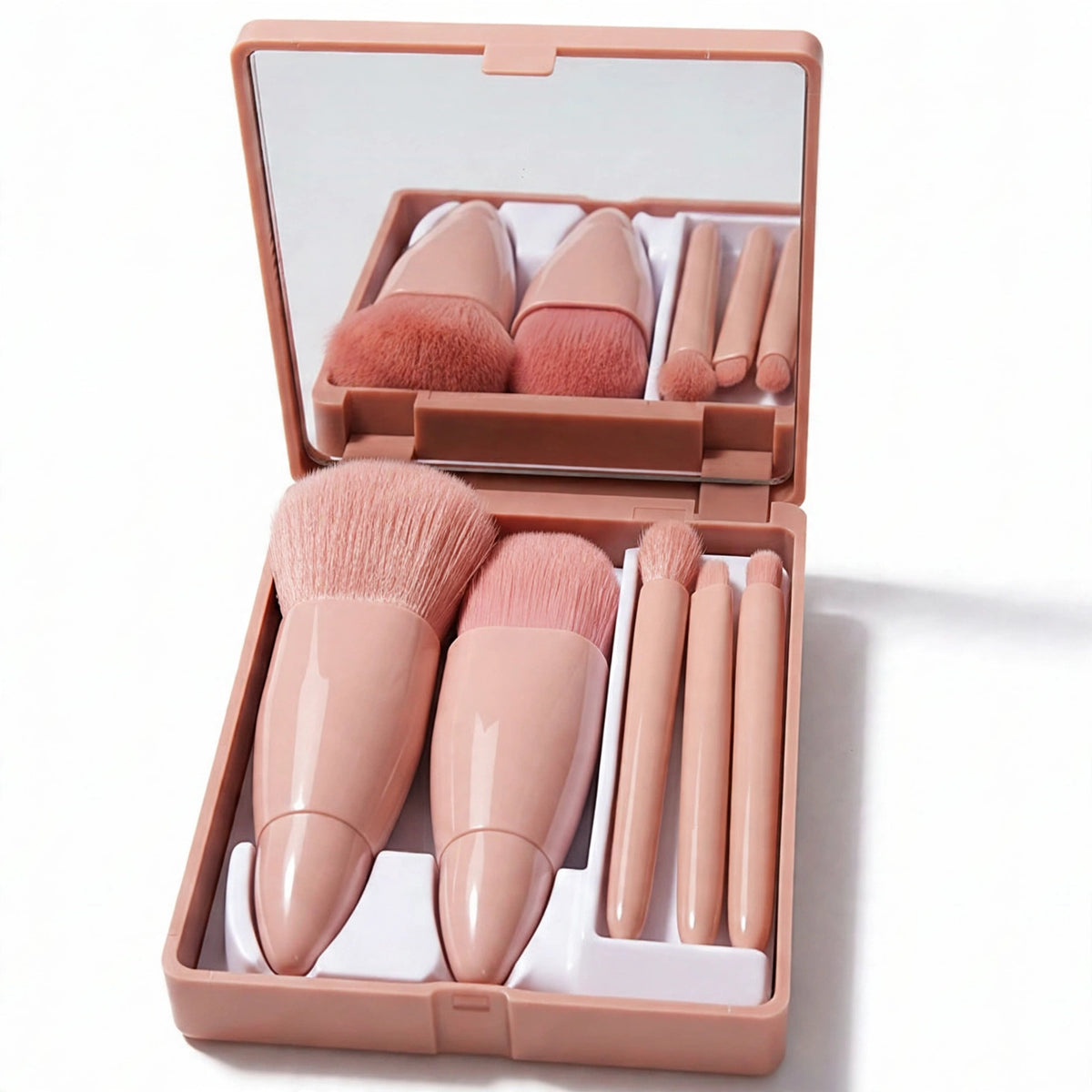 Close-up of beige faux-suede compact case with five makeup brushes and built-in mirror
