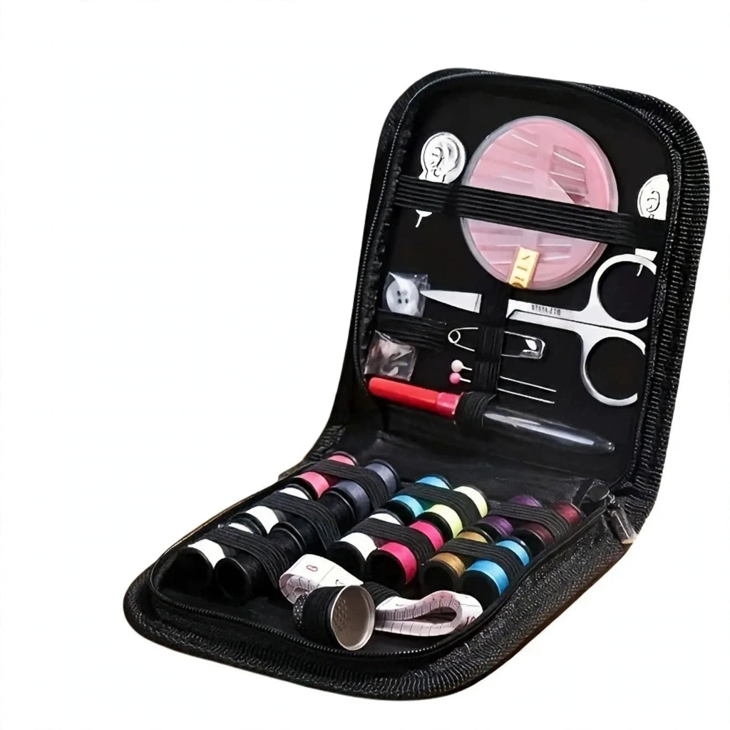 Close-up view of the portable mini travel sewing kit contents including needles, thread, buttons, and scissors