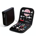 Portable mini travel sewing kit in a slim black case with needles, thread, buttons, and scissors