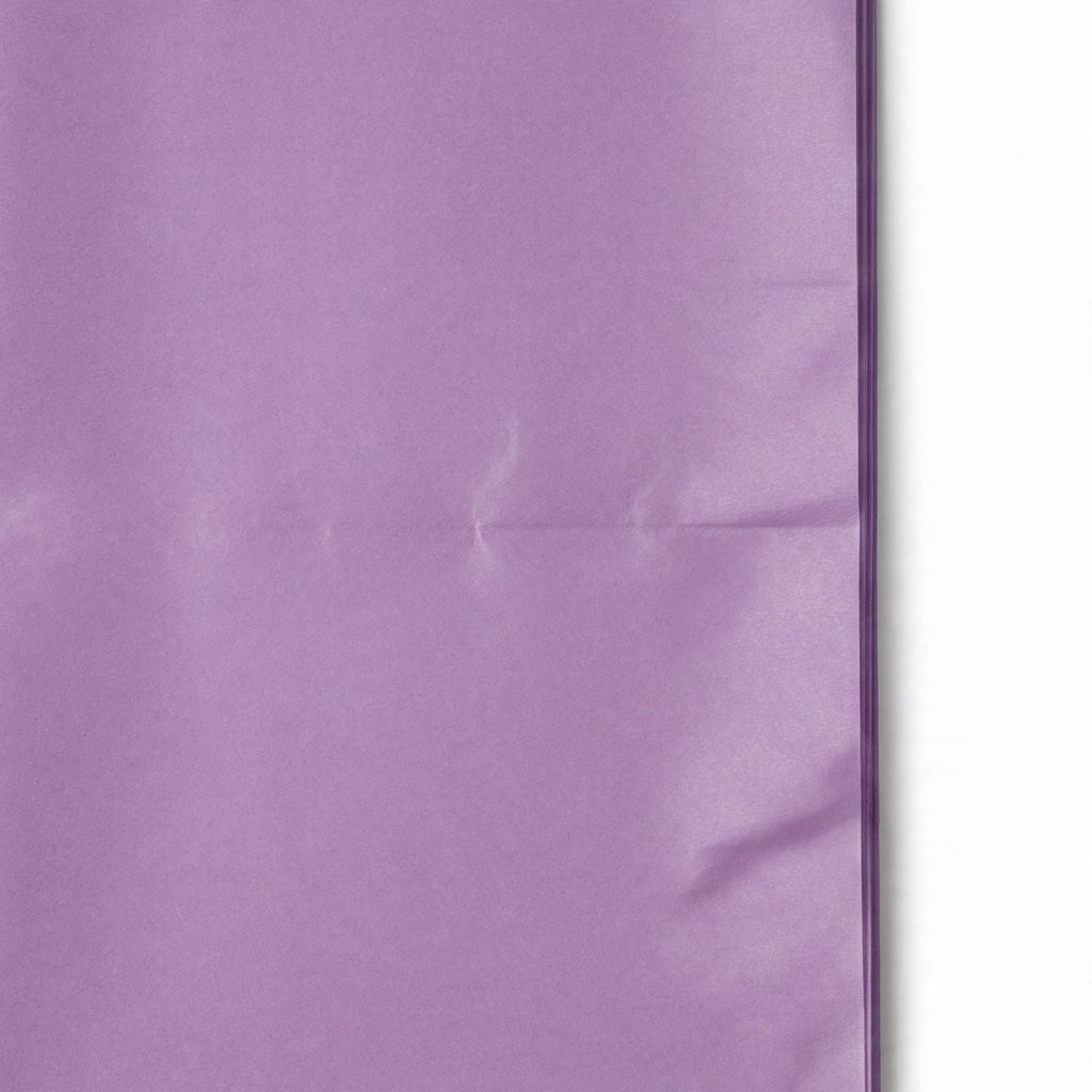 Close-up view of purple tissue paper sheets showing texture and flexibility