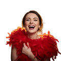 Red feather boa worn as a party accessory for fancy dress or themed events on a white background