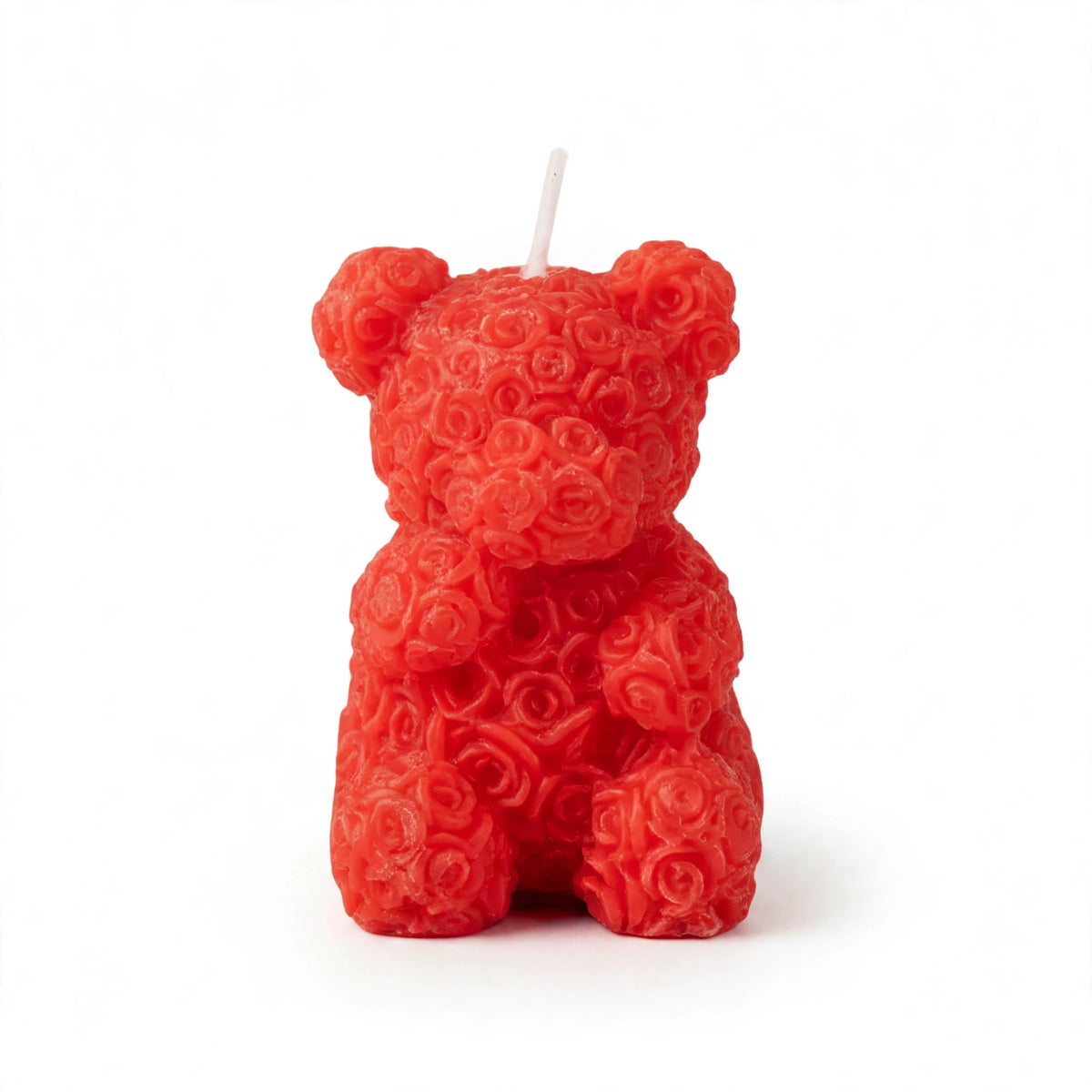 Scented rose bear candle decorated with miniature rose petals standing 6.6cm tall