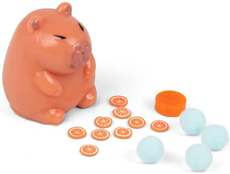 Scrunchems Sticky Squishy Capybara with all contents laid out — capybara figure, orange slice stickers and blue sticky balls
